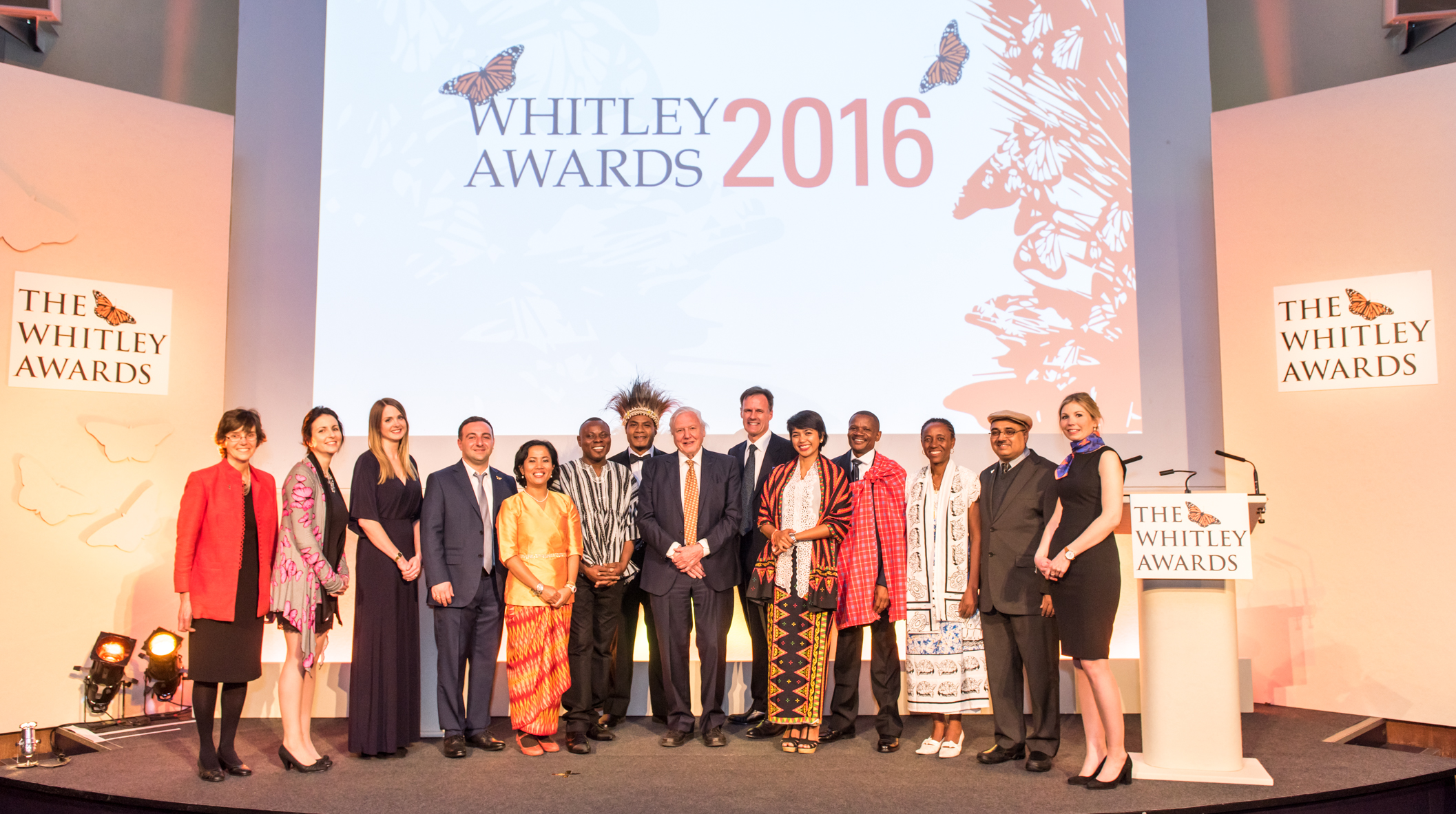Left to right: Alison Rosser, Tracey Rennie-Starke, Danni Parks, Alexander Rukhaia, Hotlin Ompusunggu, Gilbert Adum, Karau Kuna, Sir David Attenborough, Edward Whitley, Farwiza Farhan, Makala Jasper, Juliette Velosoa, Muhammad Ali Nawaz, Rebecca Sennett